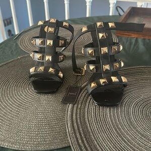 Black and gold heels brand new